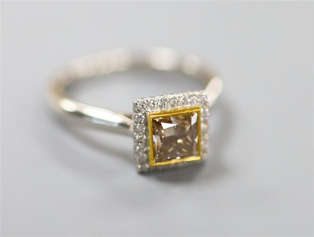 A modern platinum and single stone square modified brilliant cut natural dark yellowish brown diamond set square cluster ring